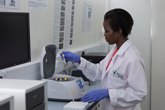 Nurse using a Centrifuge machine