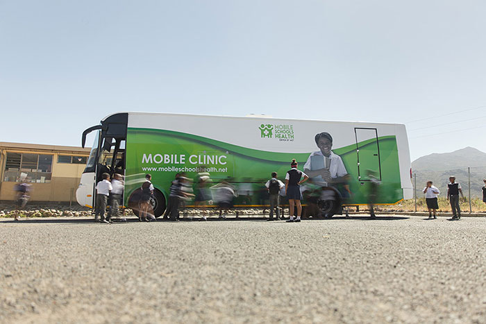 Mobile clinic parked at a school